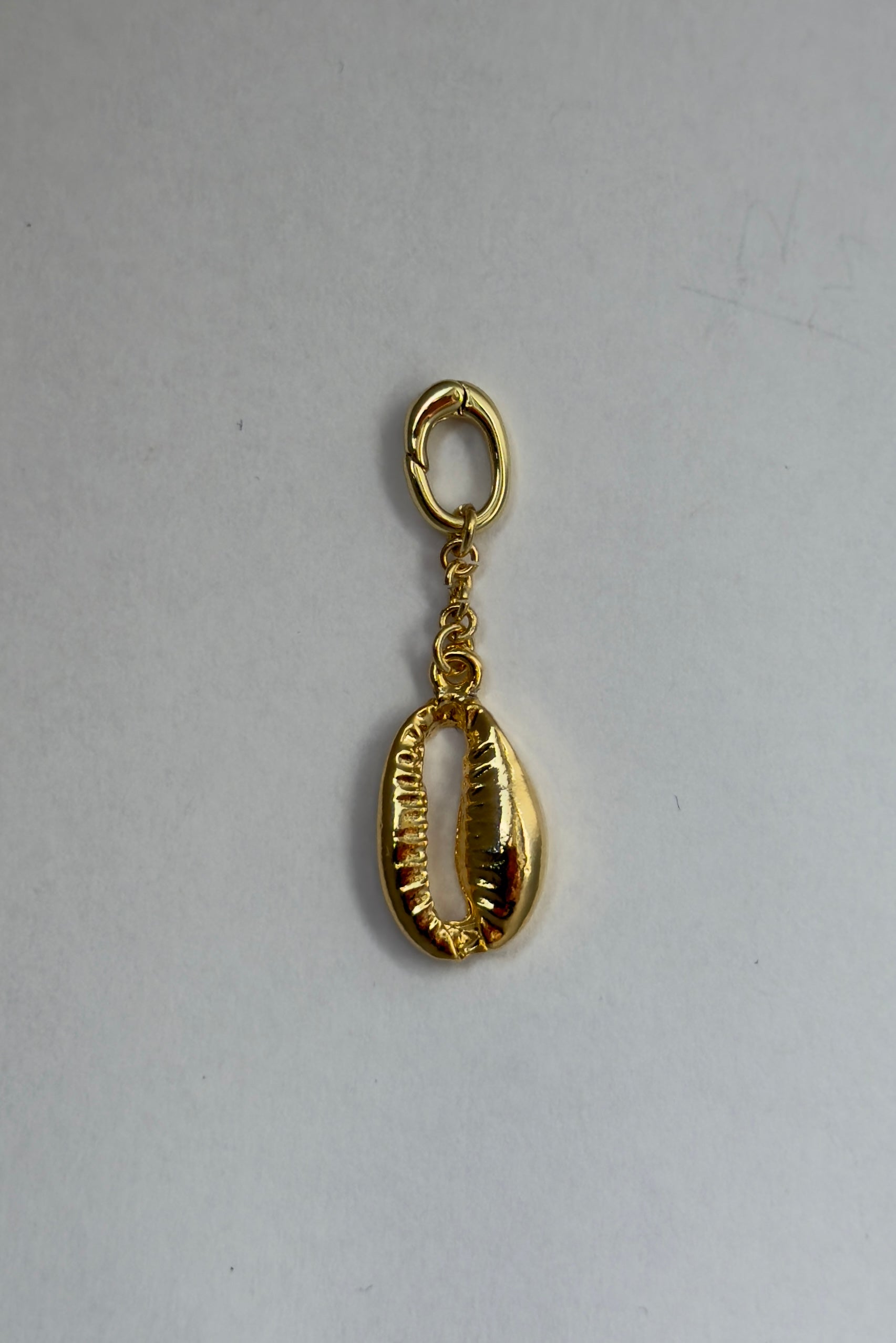 Gold cowrie shell bikini charm
